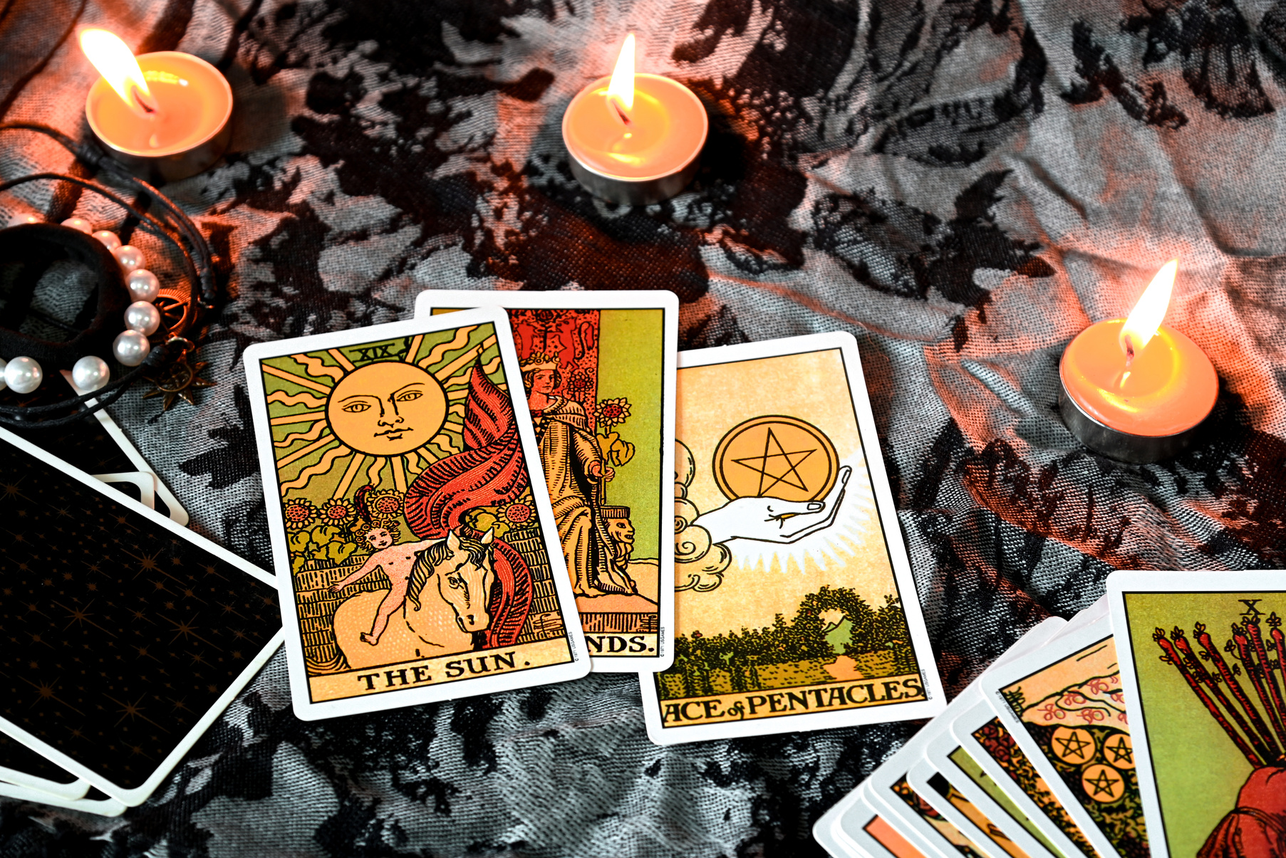 Tarot reading with tarot card background and candlelight on